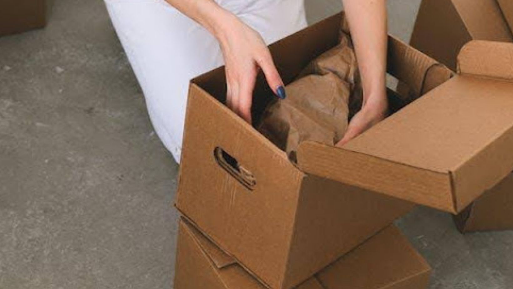 Person unpacking a box