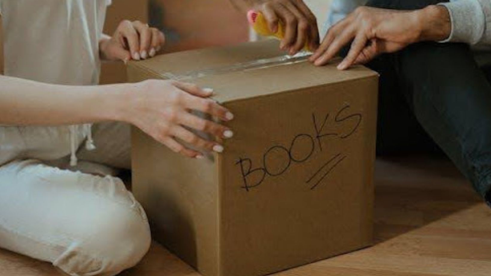 People touching a box